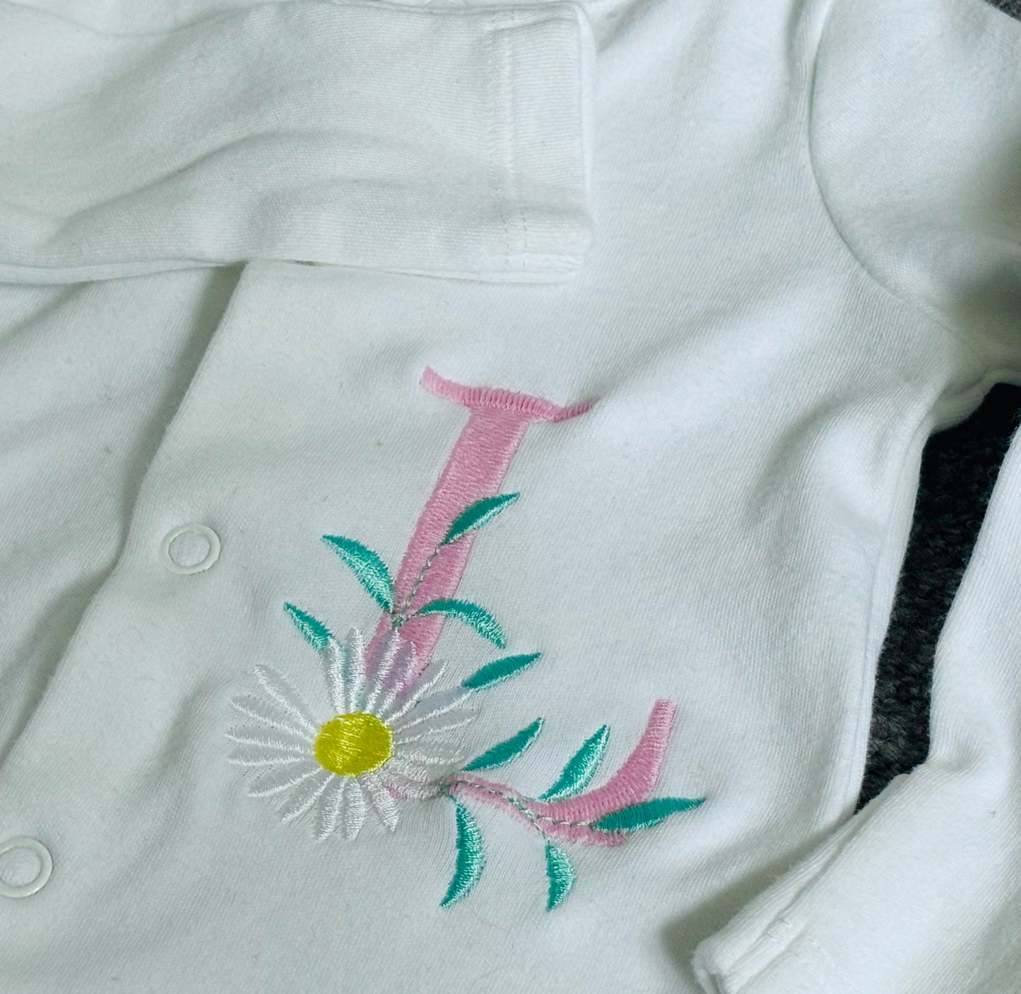 Rebel Needleworks pink daisy monogram embroidered sleepsuit - personalised baby girl gift UK