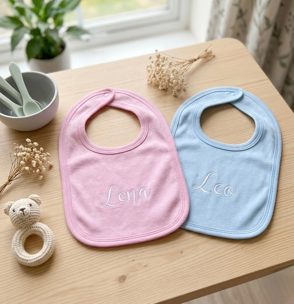 Custom embroidered pull over baby bib by Rebel Needleworks - personalised baby gift UK