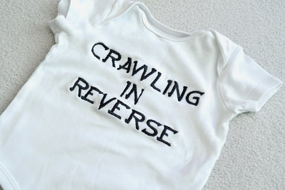 Rebel Needleworks crawling in reverse embroidered baby grow - funny personalised baby gift UK