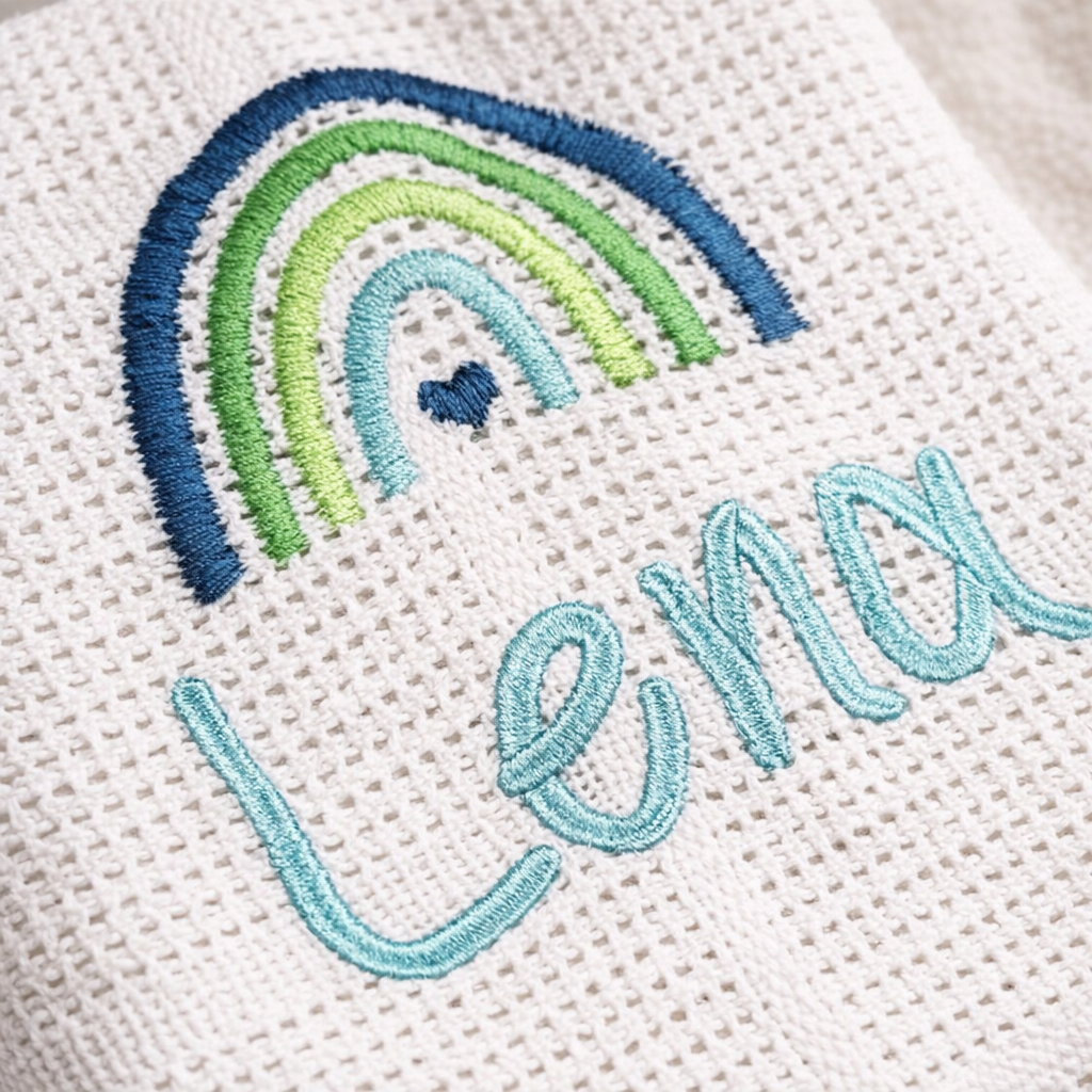 Custom boho rainbow baby blanket by Rebel Needleworks - personalised embroidered newborn gift UK