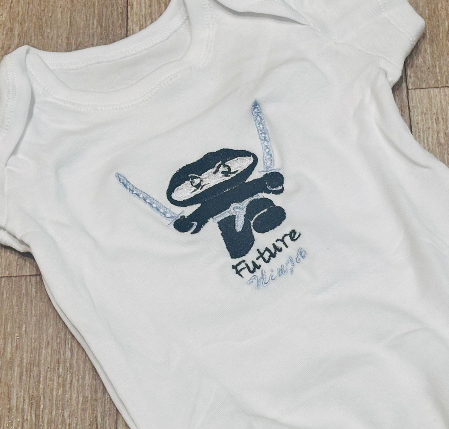 Custom future ninja embroidered baby onesie by Rebel Needleworks - personalised baby gift UK