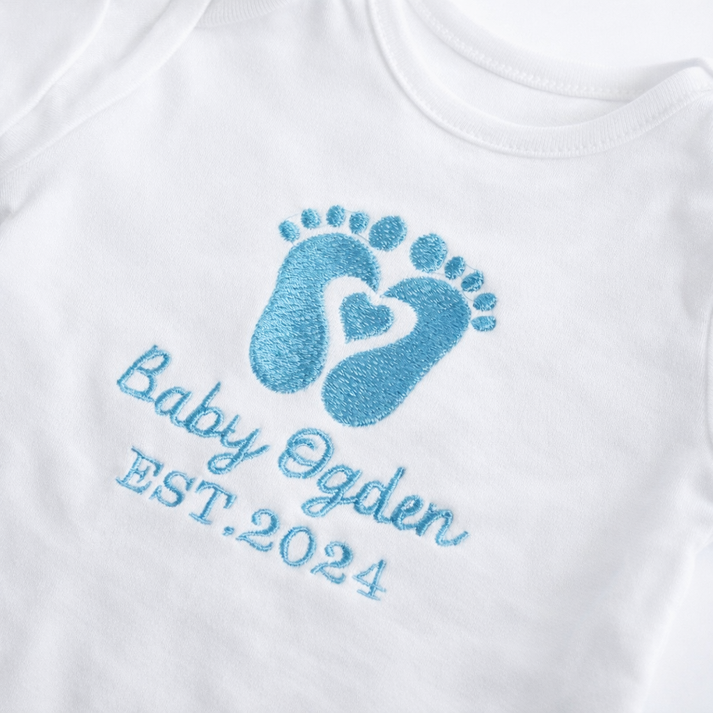 Personalised baby grow with embroidered footprints by Rebel Needleworks - custom newborn keepsake UK