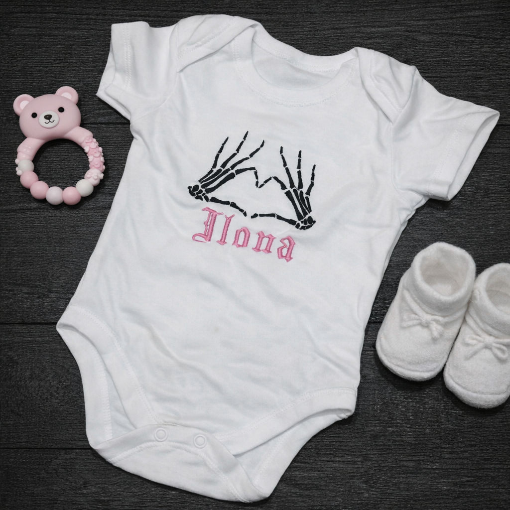 Personalised embroidered skeleton heart baby grow by Rebel Needleworks - gothic custom newborn gift UK