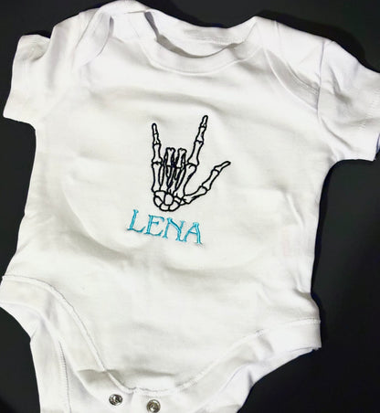Personalised skeleton baby grow by Rebel Needleworks - gothic embroidered alternative baby gift UK