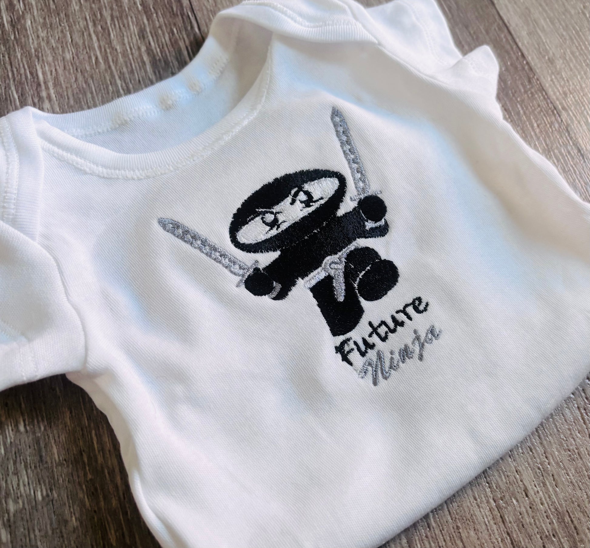 Personalised ninja embroidered baby grow by Rebel Needleworks - custom baby gift UK