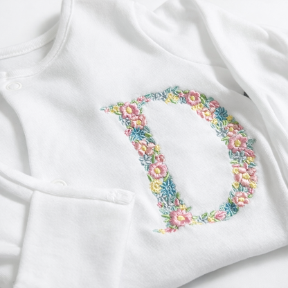 Floral letter embroidered sleepsuit by Rebel Needleworks - personalised baby girl gift UK