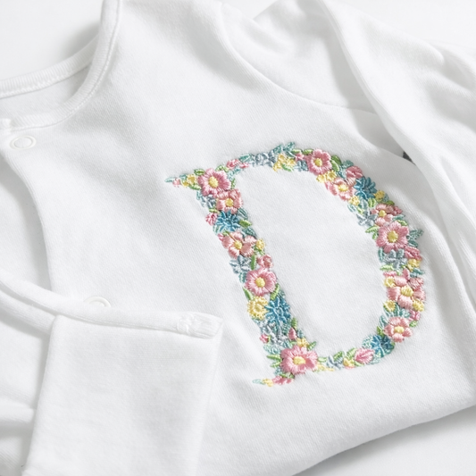Floral letter embroidered sleepsuit by Rebel Needleworks - personalised baby girl gift UK