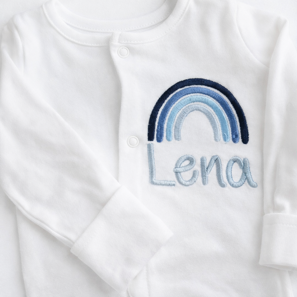 Personalised rainbow embroidered sleepsuit by Rebel Needleworks - custom baby gift UK