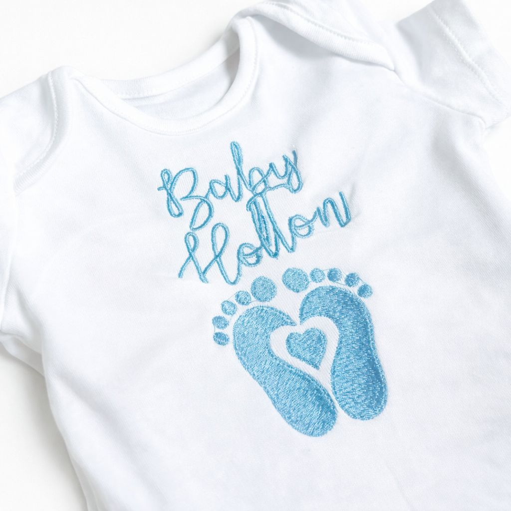 Custom embroidered name footprint baby grow by Rebel Needleworks - personalised baby gift UK