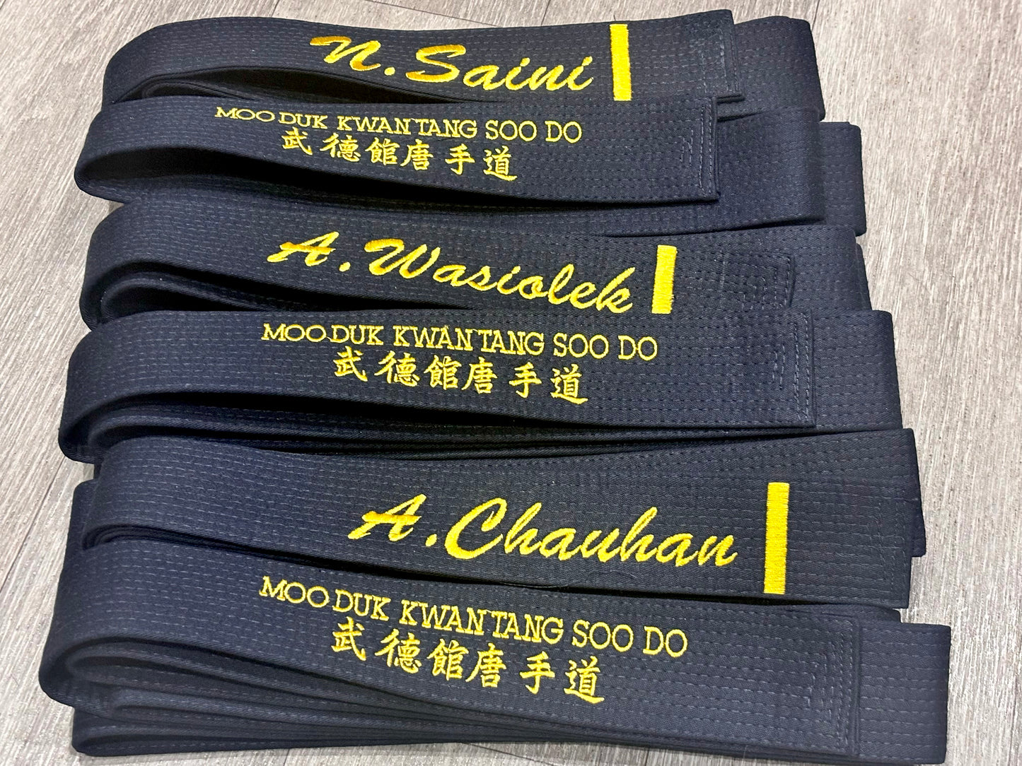 Custom embroidered martial arts belt by Rebel Needleworks - personalised karate judo belt UK