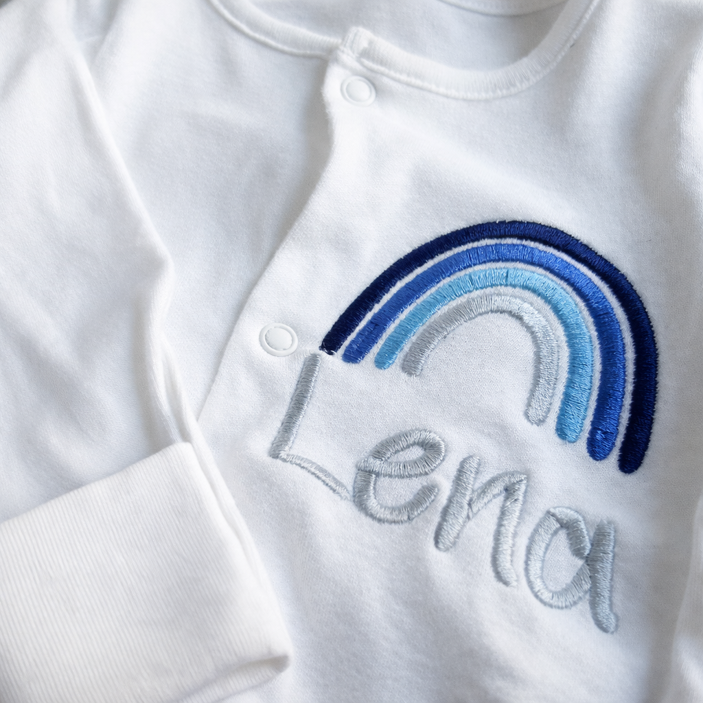 Custom rainbow embroidered personalised sleepsuit by Rebel Needleworks - baby gift UK