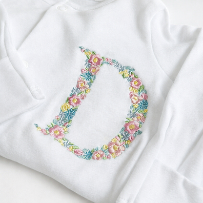 Rebel Needleworks floral letter embroidered sleepsuit - personalised baby girl gift UK