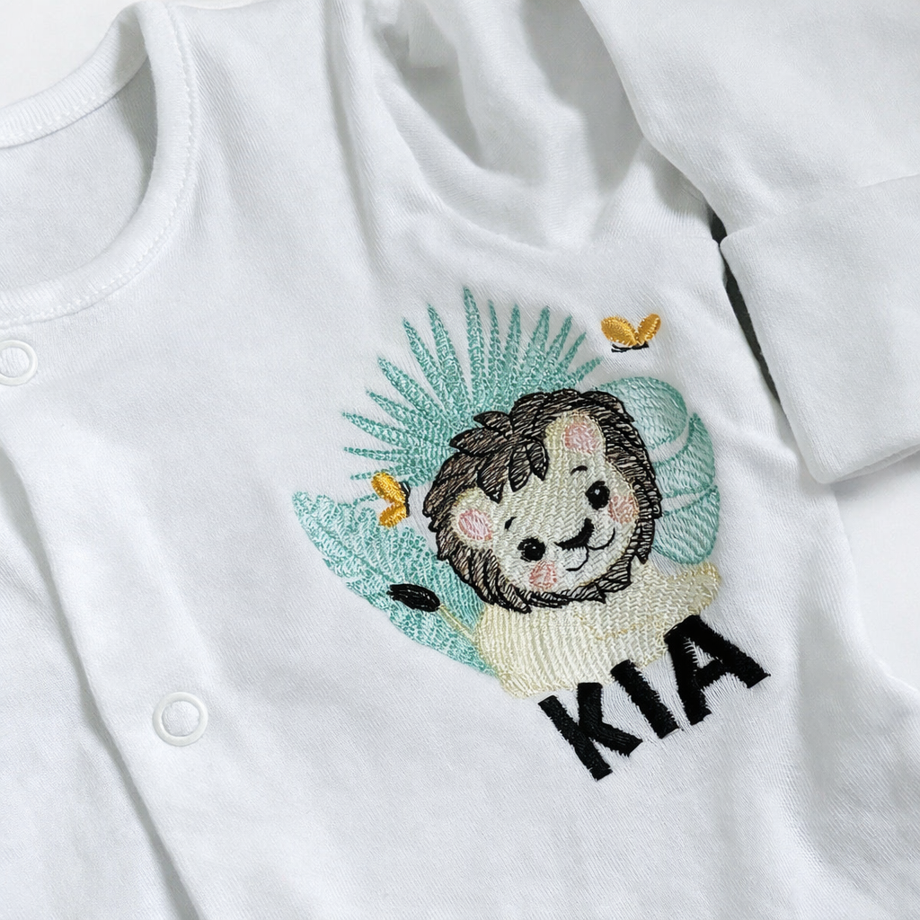 Safari lion embroidered personalised sleepsuit by Rebel Needleworks - custom baby gift UK
