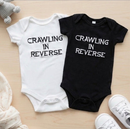Crawling In Reverse Embroidered Baby Grow