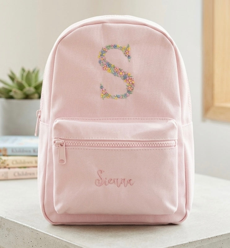 Custom floral monogram embroidered backpack by Rebel Needleworks - personalised nursery bag UK