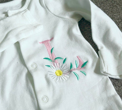 Pink daisy monogram embroidered sleepsuit by Rebel Needleworks - personalised baby girl gift UK