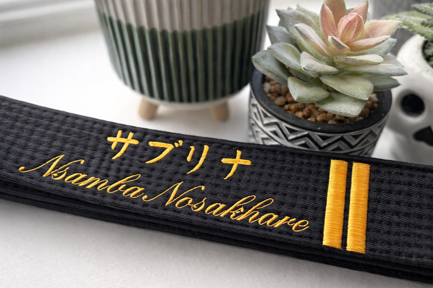 Personalised embroidered martial arts belt by Rebel Needleworks - custom karate belt UK