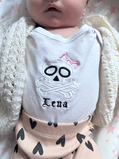 Custom skull bow embroidered baby grow by Rebel Needleworks - alternative gothic newborn gift UK