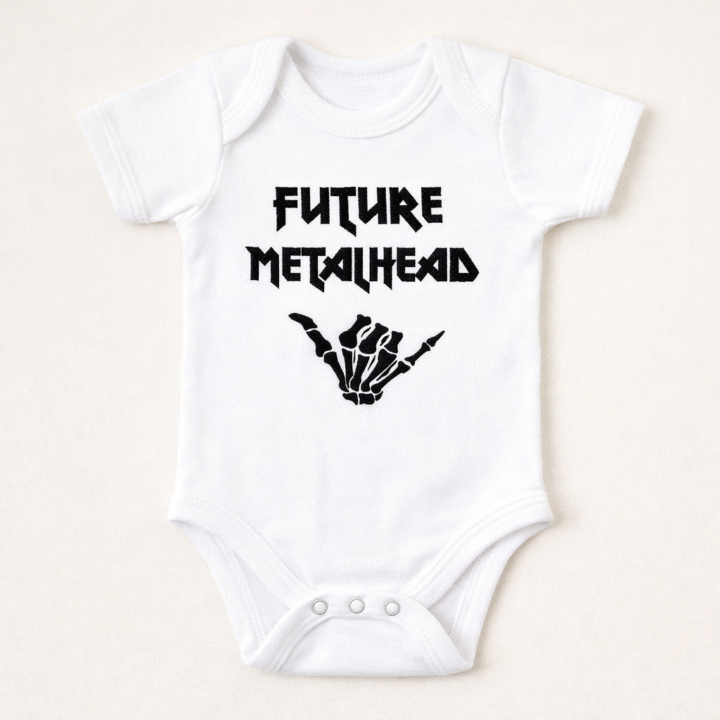 White baby onesie embroidered gothuc alt with 'Future Metalhead' text and hand gesture design on a beige background